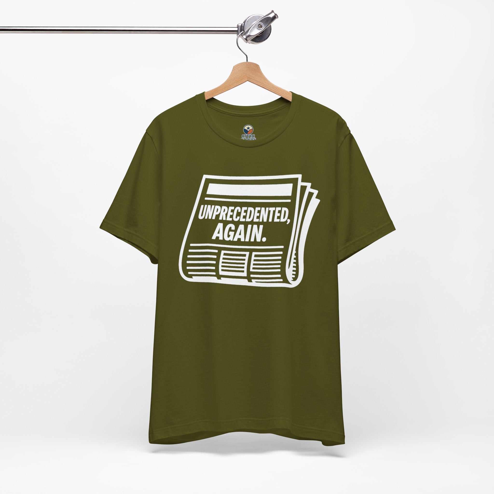 Unprecedented Again tee— Olive  - accent — angled hanging
