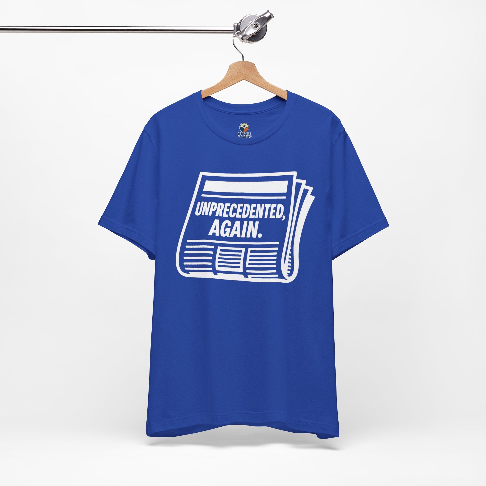Unprecedented Again tee— True Royal - accent — angled hanging
